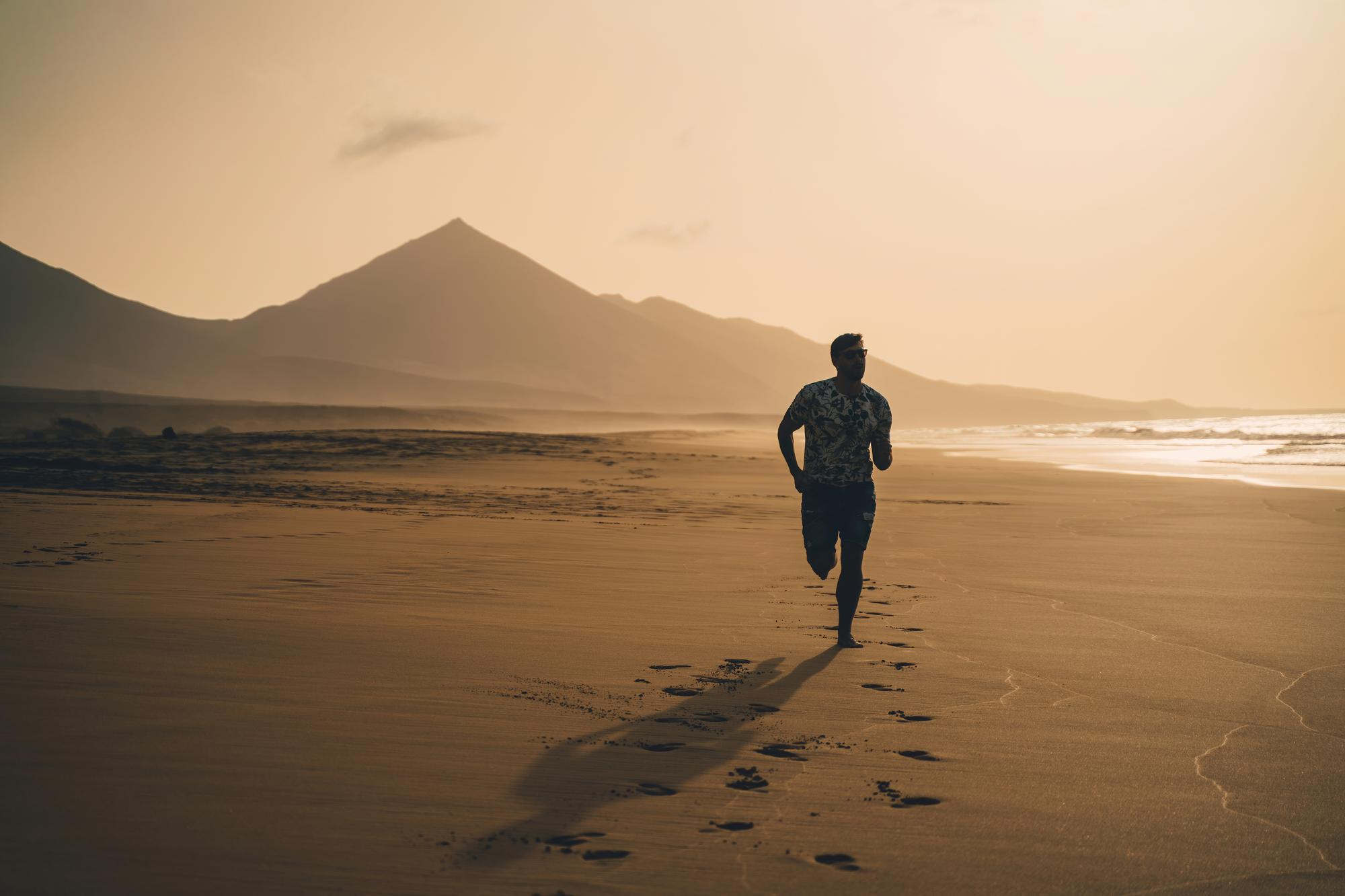 full-length-man-running-beach
